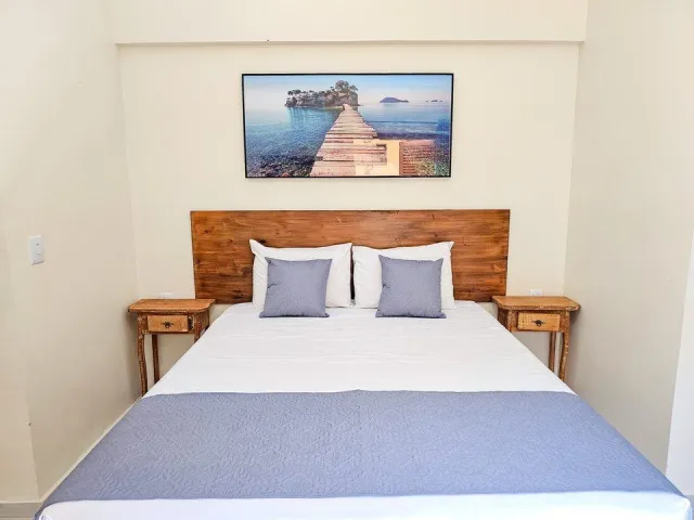 Cama de casal do Quarto Deluxe Hidromassagem 5204 do Ilha Flat Hotel