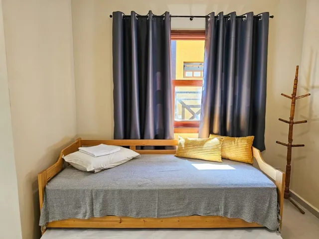Sofá-cama do Quarto Deluxe Hidromassagem 5204 do Ilha Flat Hotel