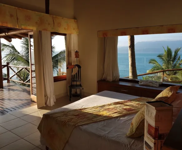 Suíte com vista para o mar na Pousada Singuitta